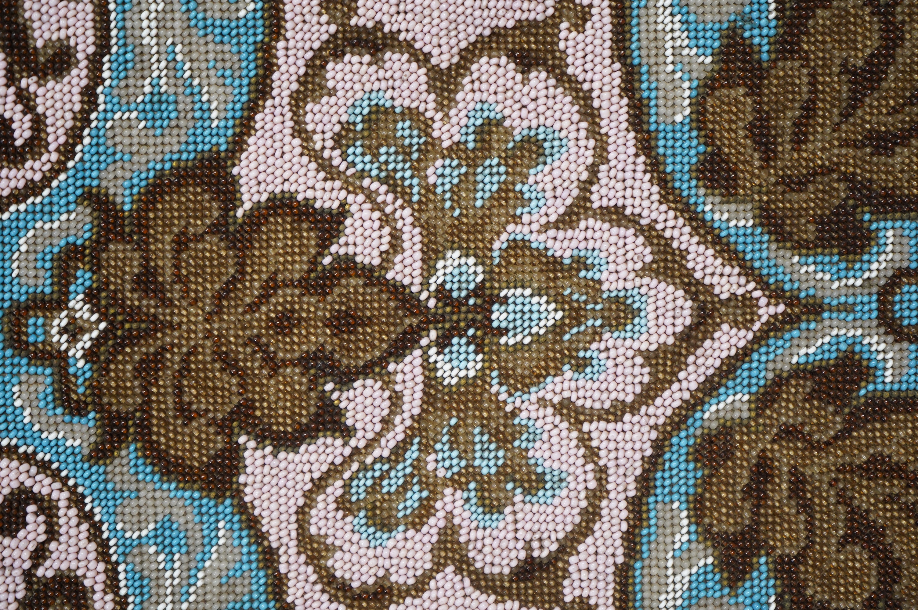 A 19th century unused Berlin beadwork tea cosy, worked in pink, turquoise, brown and white beads, beaded on two sides, the sides still joined. Ideal to convert as a cushion cover or two matching cushion covers, 55cm (tot